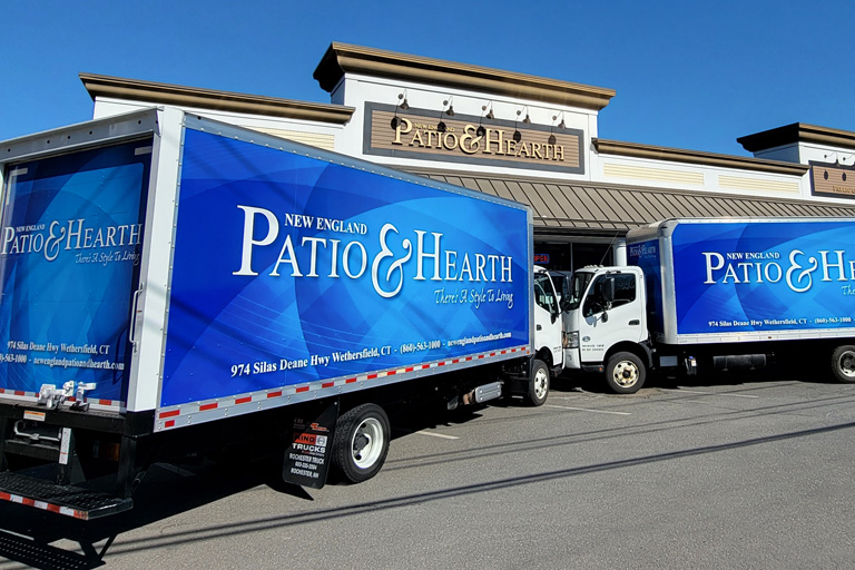 New England Patio Trucks in front of showroom